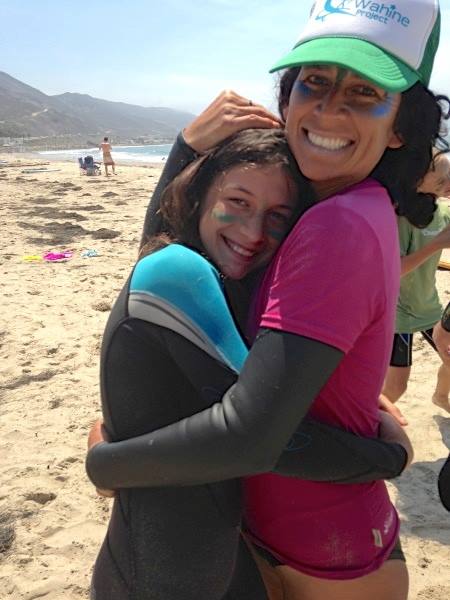Dionne Ybarra and a Wahine participant clad in Zinka, colorful sunblock.
