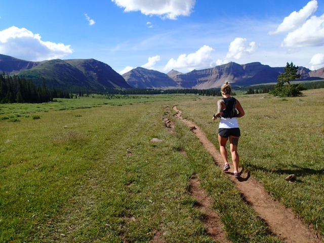 Steff Gardner running with mountains in the background