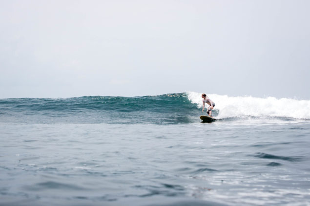 Stephie Buergler surfing in Indonesia. Photo by Deni Firman.