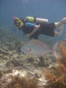 The writer SCUBA diving in Bonaire, the Caribbean.
