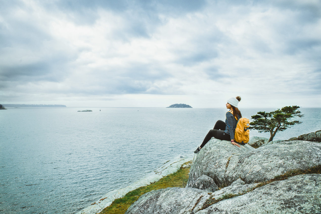 Eman Zabi looking at the horizon at Whytecliff Park in West Vancouver. Image credit Anita Lee Photography