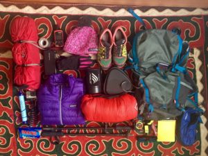Jenny Tough's gear including her backpack, tennis shoes, down jacket, hat, tent, etc.
