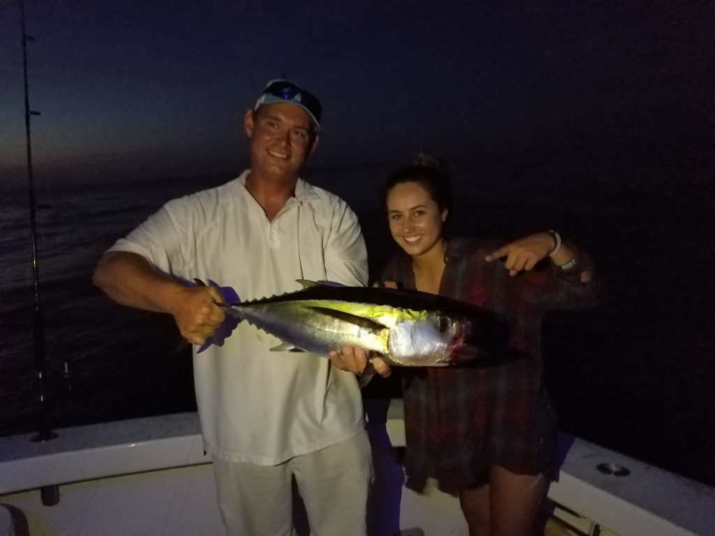Guest and Alex P holding a yellowfin tuna off West Palm Beach, FL.
